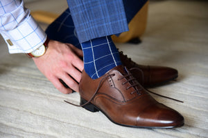 Elegant blue dress socks for a formal occasion with a matching outfit