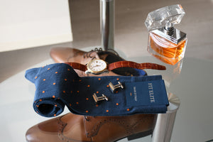 Blue dress socks for men with orange polka dots matching gold watch and cufflinks
