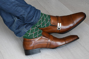 Men's colorful dress socks, green with red dots, inside brown shoes