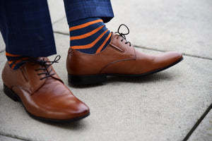 Fun dress socks for men, blue with bright orange stripes, matching brown dress shoes