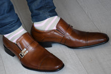 Man wearing pink striped socks with brown monk strap shoes
