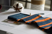 Luxury socks for men, navy blue with bright orange stripes, made from premium cotton