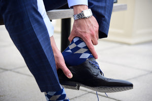 Stylish argyle dress socks for men matching a blue suit