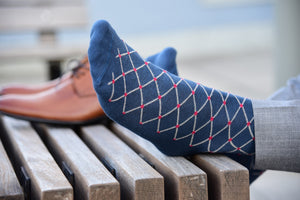 Colorful socks for men, navy blue patterned with a red polka dot design