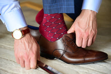 Man wearing luxury red dress socks with brown oxford shoes