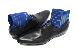 Men's ribbed dress socks, blue with grey vertical stripes, displayed inside black shoes