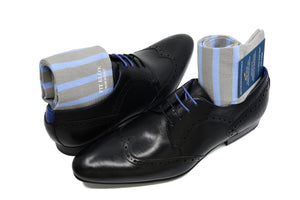 Men's striped dress socks, blue and grey, displayed inside black shoes