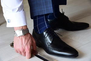Trendy dress socks for men with a checkered design, matching cufflinks and a square watch